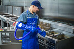Filta technician services a fryer. (PRNewsfoto/Filta)