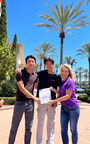 Pretend City Co-Founder Sandy Stone accepts donation from Connor Wong and Wilson Song to support Pretend City
