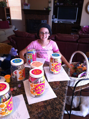 Jessie Joy Rees stuffing JoyJars to deliver to kids battling cancer in the hospital. (Photo credit: Jessie Rees Foundation.)