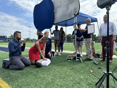 Interpreter Jerrin George, Miss DC Jude Maboné, and Korin Hudson, MD, demonstrate CPR/AED with Gallaudet University students and staff.