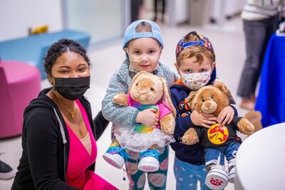 Wish kid Krystin smiles with two young visitors of Seattle Children’s Hospital, each of whom enjoyed a make-your-own Build-A-Bear experience during their visit. Krystin assisted young guests throughout her wish event, providing furry friends for patients as well as their siblings.