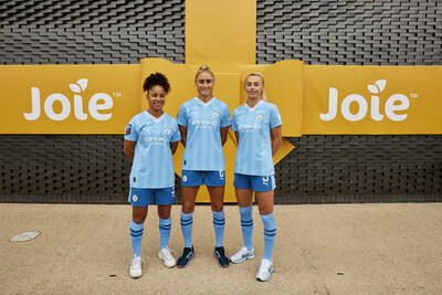 Manchester City Women's players Demi Stokes, Steph Houghton and Chloe Kelly in front of the Joie Stadium