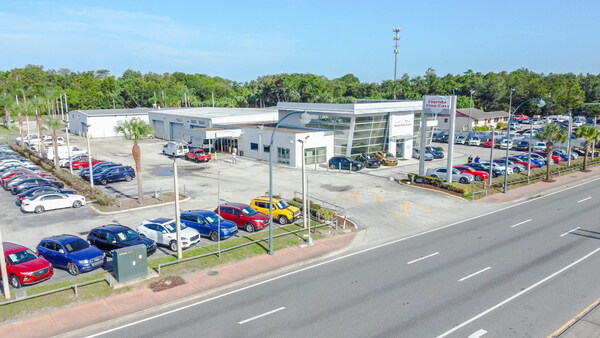 Florida Fine Cars Orlando Dealership featuring a colorfully wide selection of quality pre-owned vehicles.