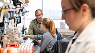Researchers at Gladstone Institutes and UC San Francisco—including Theodore Roth (left) and Franziska Blaeschke (center)—used a new method to screen 10,000 combinations of gene edits in immune cells engineered to fight cancer. Photo: Michael Short/Gladstone Institutes