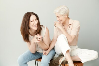 Terri Bryant, Founder of GUIDE Beauty, and Selma Blair, QVC Brand Ambassador for Accessibility and Chief Creative Officer of GUIDE Beauty, together sitting, laughing and connecting.
