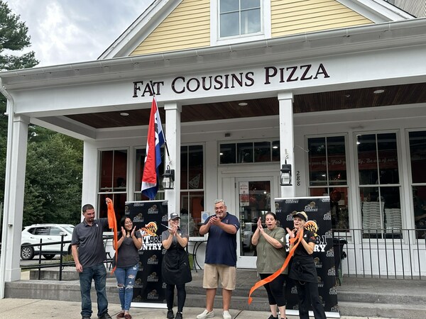 Owner, David Moura, celebrates grand opening of Norton Fat Cousins location with General Manager, Sandie Parker, and Cherie Balestra, Wade Cordeiro, Molly Saunders and Eulalia Ferreira.