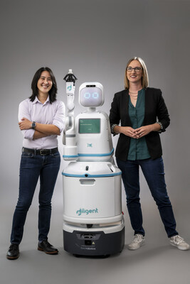 Caption: Dr. Andrea Thomaz and Dr. Vivian Chu from Diligent Robotics with Moxi, the first and only socially-intelligent robot teammate in the field today who works across health systems to improve operational efficiency of hospital care teams so they have more time for patient care and can practice at the top of their license.