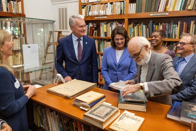 President of Lithuania, Dr. Gitanas Nausėda, and Lithuanian First Lady, Diana Nausėdienė with group reviewing the Marija Gimbutas Collection