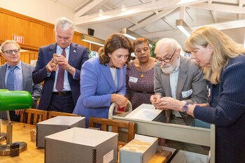 President of Lithuania, Dr. Gitanas Nausėda, and Lithuanian First Lady, Diana Nausėdienė with group reviewing the Marija Gimbutas Collection