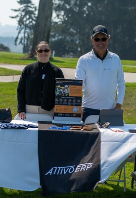 Len Reo, president of the Attivo Group with Emily Perez at Sponsorship Table at Tipalti Golf Tournament