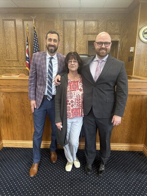 A jury awarded a record-breaking $6.19 million to a man who suffered a traumatic brain injury (TBI) that led to a brain bleed while he was admitted to Firelands Hospital. Tittle & Perlmuter attorneys Scott Perlmuter (left) and Allen Tittle (right) with the plaintiff's wife, Melissa Johnson (middle).