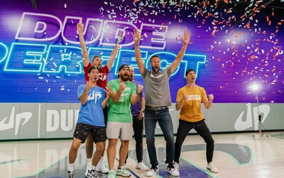 Booster founder and CEO, Chris Carneal, celebrates with YouTube and trick shot stars Dude Perfect at their headquarters in Frisco, TX.