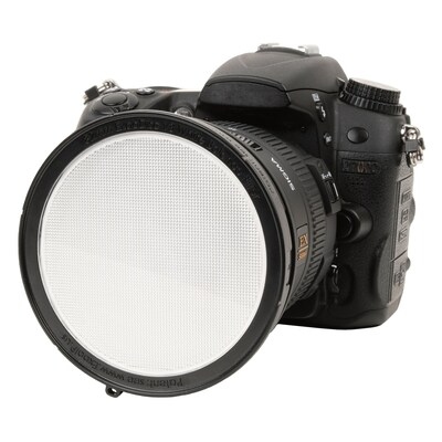 ExpoDisc v3 shown attached to the camera lens using the bayonet mount