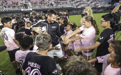 Kids from the local community gather around soccer sensation Leo Messi at "The Hard Rock Messi Kids Menu" launch event at DRV PNK Stadium on October 2 before training with him in Ft Lauderdale, Fla. (James McEntee/AP Images for Hard Rock International)