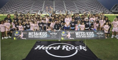 Kids from the local community pose with world-renowned soccer sensation Leo Messi at "The Hard Rock Messi Kids Menu" launch event at DRV PNK Stadium on October 2 in Ft. Lauderdale, Fla. (James McEntee/AP Images for Hard Rock International)