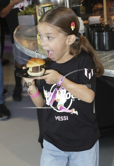 Salome Rivas is excited to try "The Hard Rock Messi Kids Menu," featuring the Messi X Burger, the Messi Golden Chicken Sandwich, and other kid-friendly options; makes a nod to the international sports icon with a complimentary mini golden soccer ball toy, a collectible poster, activity sheet and stickers with every meal on Monday, Oct. 2, 2023, in Fort Lauderdale, Fla. (James McEntee/AP Images for Hard Rock International)