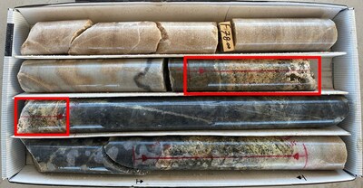 Figure 2. Eudialyte in a vein between 78.46 and 78.78 m below ground surface in drill hole JV-23-01 (interval denoted in red boxes). (CNW Group/Monumental Minerals Corp.)
