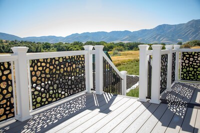 RDI® Railing’s premier line of Avalon Aluminum Railing® features an option to use Decorative Screen Panel as infills (shown here in River Rock).