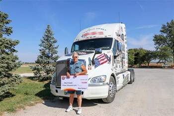 Grand prize winner of Pilot Flying J's 2023 Road Warrior Contest, Don Crouse, receives $15,000 check.