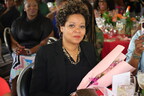 Leslie Williams Dunn, Malinda Willams' sister receiving flowers at the Arise And Shine brunch. Photo credit: Aliya Dyson