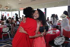 Arise and Shine event guests hug. Photo credit: Aliya Dyson