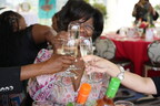 Guests toast at the Arise And Shine brunch. Photo credit: Aliya Dyson