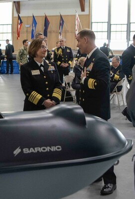 Adm. Lisa Franchetti, Vice Chief of Naval Operations and Rear Adm. Keith B. Davids, Commander, Naval Special Warfare Command discuss Saronic's 6ft Spyglass ASV at the 2023 International Seapower Symposium.