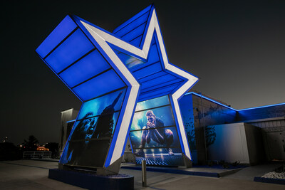 Standing tall at 32 feet, a giant Dallas Cowboys star greets Customers as they enter the Drive-Thru