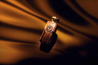 Vanilla Edesia perfume on flowing background