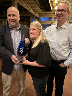 Craig McLendon and Sheila Dickerson of ICON receiving the Judi Innovation Award, presented by Abraham Gutman of AG Mednet.