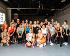 Community gathered for a group photo after completing a GRIND workout at The GRIND Garage grand opening celebration. Photo by-Erin/Sugar Plum Creative