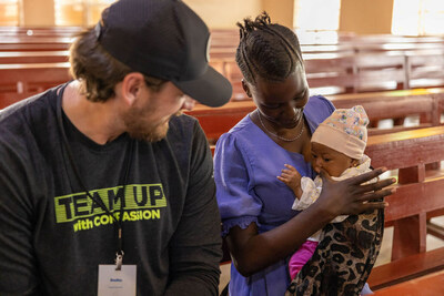 Bradley Pinion visits with a mother and baby at a Compassion survival center in Tanzania.