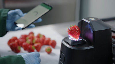 OneThird's AI-powered, real-time shelf-life technology in use on a strawberry grower's packing line.