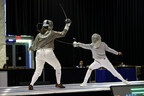 Lydia Fabry scoring a gold medal touch in Veteran Fencing World Championships – Photo by: Serge Timacheff for USA Fencing