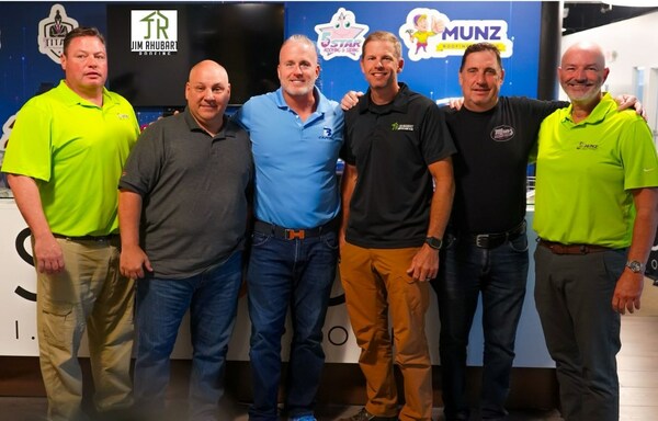 Photo (L-R): Brian Toff, Dean Mainardi, Lance Bachmann, Jim Rhubart, Chris Munz, and Mike Shelly celebrate the new roll-up merger of three roofing companies.