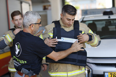The International Fellowship of Christians and Jews (IFCJ/The Fellowship) distributes new flak jackets to firefighters in Rishon LeZion, Israel last week. The Fellowship allocated some of its emergency funding for the purchase of 1,000 flak jackets for first responders and security personnel on the frontlines. © 2023 IFCJ/Guy Yechiely