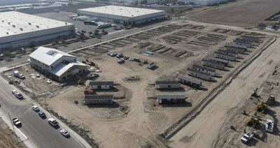 Future site of The Neighborhood Village with a large Unity Hall with the first 16 of 53 homes.