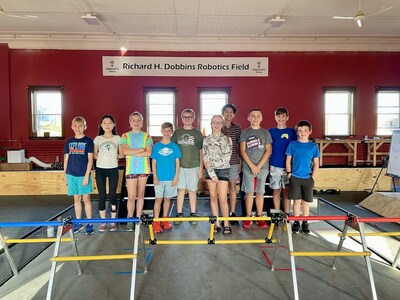 Innovate Albion’s FIRST Tech Challenge (6th - 8th grade) team Sparks and Duct Tape gather for a team picture on the 2023 competition field for the game, CenterStage presented by Raytheon Technologies.