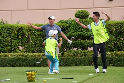 Professional golfer Collin Morikawa (rear left) mentors local junior golfers from the Macau Junior Golf Association during the Sands Golf Day event Monday at the Front Lawn (between The Parisian Macao and the Four Seasons Hotel Macao Cotai Strip).