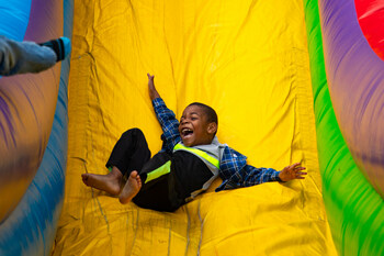 A young Guest enjoys the giant slide at the Casey Jones Village Festival Saturday, Oct. 14, 2023.