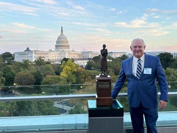 Titan America Senior Vice President Walter Reed accepts the award on behalf of Pennsuco.