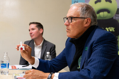 Governor Inslee holding naloxone nasal spray. Photo credited to Jim Kopriva with the Office of Governor Jay Inslee.