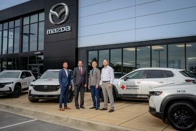 Michael Ponter of Hiley Mazda (left), Mark Beddingfield of American Red Cross (middle-left), Naoki Okano of Mazda North American Operations (middle-right), and Matt Meyer of Hiley Mazda (right) gather to exchange 2024 Mazda CX-50s for community emergency vehicles in Alabama.
