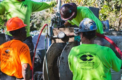 A Cemplex leveling crew getting their mix ratios just right.