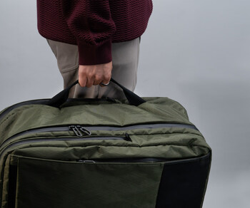 Nylon side handles allow suitcase-style carry or quick-grab