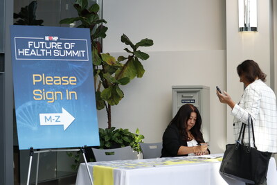 A guest enters the 2023 Future of Health Summit at Inland Empire Health Plan’s Rancho Cucamonga Headquarters on Oct. 13.