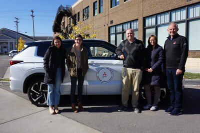 Mitsubishi Motors North America, Inc.'s Community Utility Vehicle program is providing Tucker's House with the use of a 2023 Mitsubishi Outlander Plug-in Hybrid SUV. Left to Right: Riley Beddingfield (Tucker's House Operations Director), Kayla Torti (Tucker's House Program Manager), Graham Honeycutt (Tucker's House Executive Director), Jessica Baggetta and Jeremy Barnes with MMNA