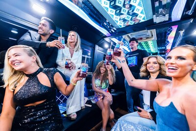 Cruising down the Las Vegas Strip during BravoCon, Bravolebrities Peter Madrigal, Daisy Kelliher, Amrit Kapai, Vicki Gunvalson, Whitney Rose, Ashley Darby, and Robyn Dixon raise a toast with WeightWatchers Points Inspired Cocktails. (Photo Credit - Enoch Kim for WeightWatchers)