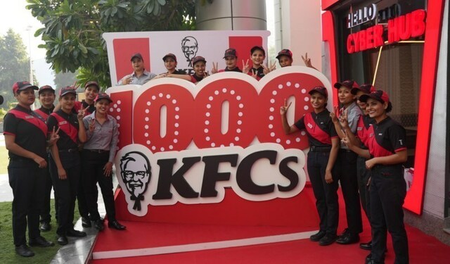 Team members join to celebrate the upcoming opening of the 1000th KFC restaurant in India.