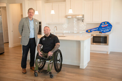 Lennar worked with Helping a Hero to adapt the new home - a Next Gen model aptly named "The Freedom" for U.S. Army Staff Sergeant Travis Strong, USA (Ret.) and his family. Pictured L to R: U.S. Army Staff Sergeant Travis Strong, USA (Ret.) with Greg Mayberry, Dallas Division President for Lennar.